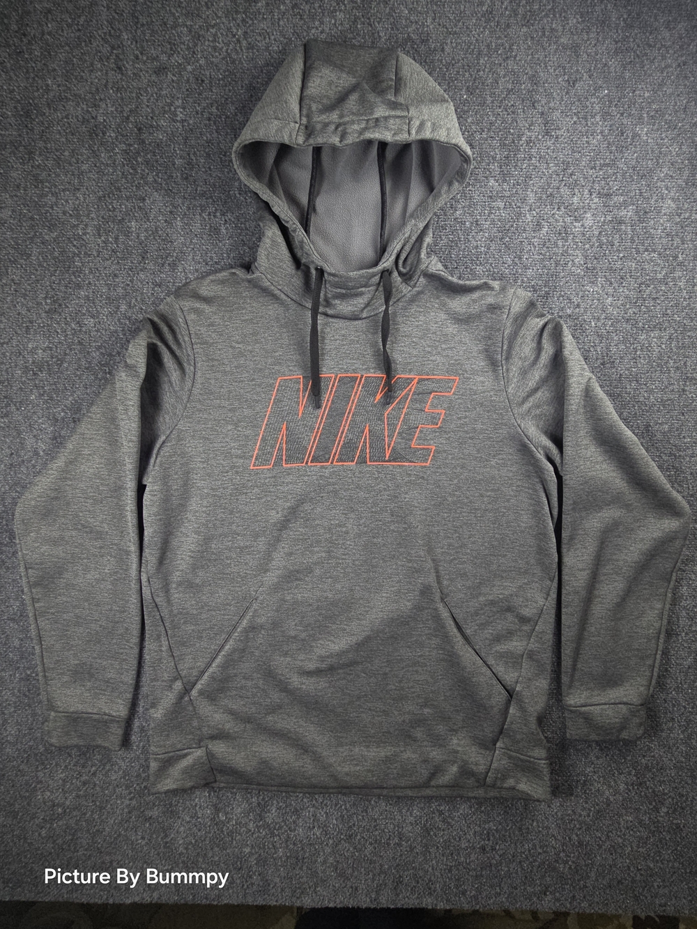 Nike Men's Dri-FIT Therma-FIT Hoodie featuring a prominent, outlined "NIKE"